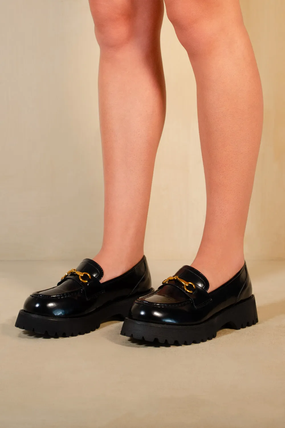 MURIEL CHUNKY SOLE SLIP ON LOAFERS WITH METAL DETAIL IN BLACK HIGH SHINE
